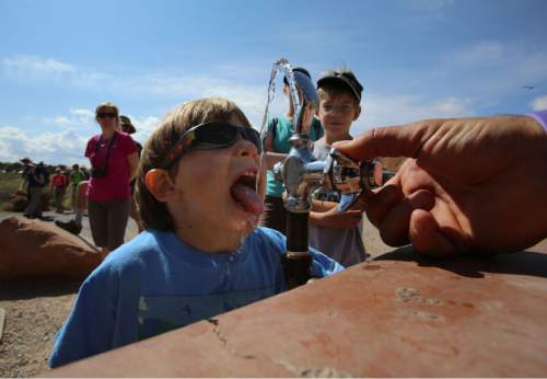Francisco Kjolseth  |  The Salt Lake Tribune
Johnny Prokop, 5, hydrates before the start of a long hike on short legs in Arches National Park in late May.