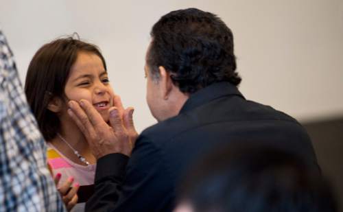 Lennie Mahler  |  The Salt Lake Tribune

Jose Luis Salazar, originally from Mexico, celebrates with his granddaughter, Natalie, after he became a U.S. citizen. 100 immigrants from 40 countries became U.S. citizens at the U.S. District Courthouse in downtown Salt Lake City, Friday, May 22, 2015.
