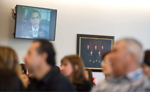 Lennie Mahler  |  The Salt Lake Tribune

People watch a video recording from President Barack Obama welcoming them as U.S. citizens during a naturalization ceremony at the U.S. District Courthouse in downtown Salt Lake City, Friday, May 22, 2015.