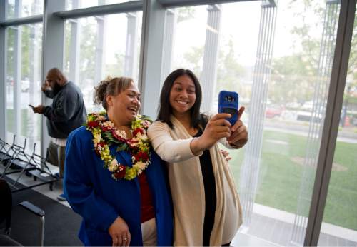 Lennie Mahler  |  The Salt Lake Tribune

Sive'a Va'aulu Faasou, originally from Samoa, and her daughter, Melanie, take a selfie after a naturalization ceremony in which Faasou became a U.S. citizen, along with 100 other immigrants from 40 countries, at the U.S. District Courthouse in downtown Salt Lake City, Friday, May 22, 2015.