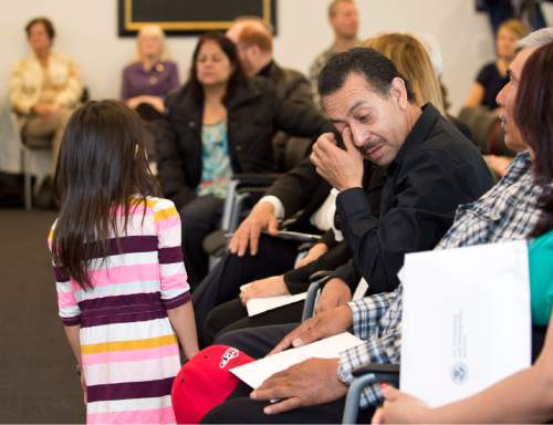 Lennie Mahler  |  The Salt Lake Tribune

Jose Luis Salazar, originally from Mexico, becomes a U.S. citizen, accompanied by his granddaughter, Natalie. 100 immigrants from 40 countries became U.S. citizens at the U.S. District Courthouse in downtown Salt Lake City, Friday, May 22, 2015.