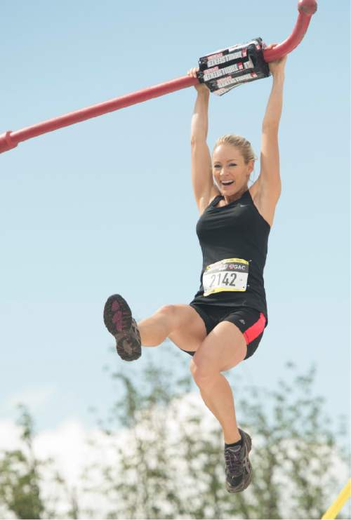 Rick Egan  |  The Salt Lake Tribune

A contestants competes in the pole vault at the 5K ThrillSeeker Stunt Run, which incorporates zip lines, the world's largest inflatable water slide, a Tarzan-like swing and punching walls, at Hee Haw Farms in Pleasant Grove, Saturday, May 23, 2015.