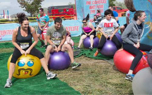 Rick Egan  |  The Salt Lake Tribune

Contestants compete in the bouncing ballerz at the 5K ThrillSeeker Stunt Run, which incorporates zip lines, the world's largest inflatable water slide, a Tarzan-like swing and punching walls, at Hee Haw Farms in Pleasant Grove, Saturday, May 23, 2015.