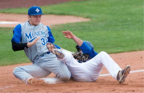 Rick Egan  |  The Salt Lake Tribune

Pleasant Grove Vikings Ben Eldredge (3) collides with Bingham Miners third baseman, Michael Green (38) , as he slides safely into third base, in Prep 5A playoff action, Bingham vs Pleasant Grove, at Brent Brown field in Orem, Friday, May 22, 2015.