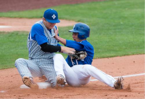 Rick Egan  |  The Salt Lake Tribune

Pleasant Grove Vikings Ben Eldredge (3) collides with Bingham Miners third baseman, Michael Green (38) , as he slides safely into third base, in Prep 5A playoff action, Bingham vs Pleasant Grove, at Brent Brown field in Orem, Friday, May 22, 2015.