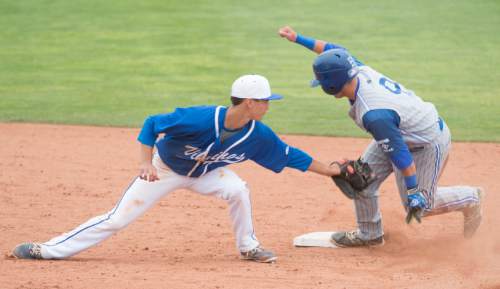 Rick Egan  |  The Salt Lake Tribune

Pleasant Grove Vikings Ben Eldredge (3) puts a tag on Bingham Miners Connor Goff (9) as he steals second base, in Prep 5A playoff action, Bingham vs Pleasant Grove, at Brent Brown field in Orem, Friday, May 22, 2015.