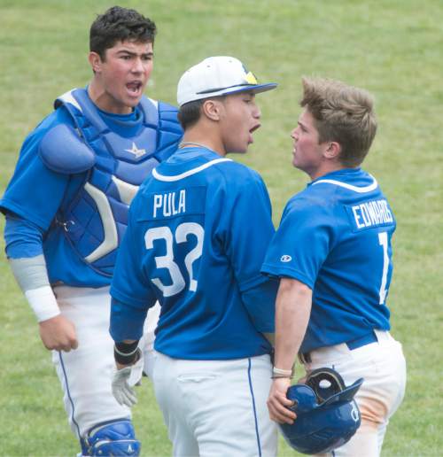 Rick Egan  |  The Salt Lake Tribune

Pleasant Grove players Payton Henry (15), Tre-C Santana (32) and Coleman Edwards (1) celebrate as the Vikings rally for 5 runs in the 5th inning, in Prep 5A playoff action, Bingham vs Pleasant Grove, at Brent Brown field in Orem, Friday, May 22, 2015.