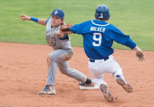 Rick Egan  |  The Salt Lake Tribune

Bingham Miners Kade Cloward (2) tags second base for an out, as Pleasant Grove Vikings Easton Walker (9) slides into second, in Prep 5A playoff action, Bingham vs Pleasant Grove, at Brent Brown field in Orem, Friday, May 22, 2015.