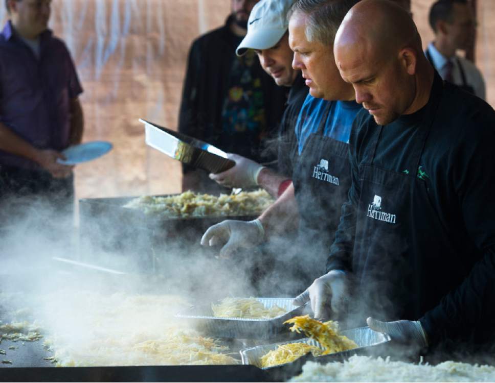 Steve Griffin  |  The Salt Lake Tribune
Herriman city employees cook up hash browns, eggs, sausage and pancakes as they host their annual Memorial Day chuck-wagon breakfast at the Herriman City Park on Monday, May 25, 2015.