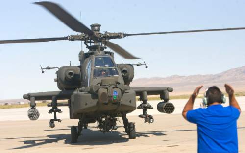 Al Hartmann  |  The Salt Lake Tribune
Aircraft of the Unmanned System Integration Capability (MUSIC) was demonstrated at Dugway Proving Grounds Thursday Sepetmeber 15.   Apache helicopter lands after the excercise demonstration.