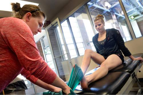 Scott Sommerdorf   |  The Salt Lake Tribune
Utah gymnast Tory Wilson rehabs her broken foot and torn achilles with Athletic Trainer Katie Lorens, left, in the training room adjacent to the Utah practice gym, Thursday, May 28, 2015.