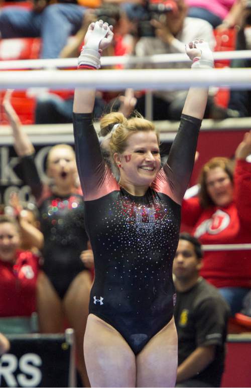 Rick Egan  |  The Salt Lake Tribune

Tory Wilson smiles as she lands her dismount from the bars for the Utes, in the Pac-12 Gymnastics Championships at the Huntsman Center, Saturday, March 21, 2015.