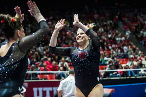 Chris Detrick  |  The Salt Lake Tribune
Utah's Tory Wilson celebrates after competing on the vault during the gymnastics meet against Michigan at the Jon M. Huntsman Center Friday March 6, 2015. Utah defeated Michigan 198.250 to 197.675. Wilson scored 9.925.