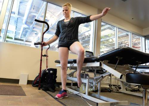 Scott Sommerdorf   |  The Salt Lake Tribune
Utah gymnast Tory Wilson balances on her right foot with the achilles injury as she rehabs her broken foot and torn achilles with Athletic Trainer Katie Lorens in the training room adjacent to the Utah practice gym, Thursday, May 28, 2015.