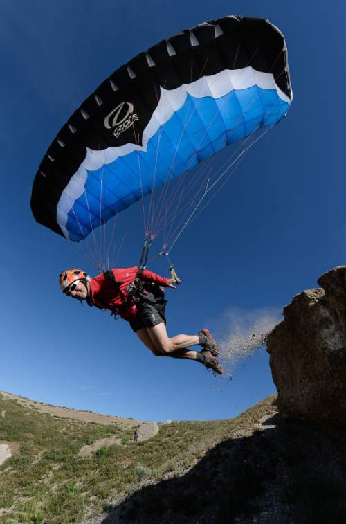 Francisco Kjolseth  |  The Salt Lake Tribune 
Paragliding instructor Steve Mayer, who has been playing in the wind for over 22-years, has a little fun with a mini-wing during a recent morning at Point of the Mountain, where updrafts make for ideal conditions for paragliders and hang gliders.