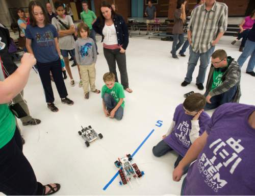 Steve Griffin  |  The Salt Lake Tribune
Robots designed and built by students enter the ring and square off in sumo-style wrestling matches during the first ever Science, Technology, Engineering and Math (STEM) Showcase. More than 100 middle school students who have been involved in an after-school STEM program in Jordan School District were part of the fun. Computer programming students will show off their work as well. This special STEM program is funded by the STEM Action Center and Utah Department of Workforce Services. The battles took place at West Jordan High School in West Jordan, Wednesday, May 27, 2015.