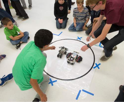 Steve Griffin  |  The Salt Lake Tribune

Robots designed and built by students enter the ring and square off in sumo-style wrestling matches during the first ever Science, Technology, Engineering and Math (STEM) Showcase. More than 100 middle school students who have been involved in an after-school STEM program in Jordan School District were part of the fun. Computer programming students will show off their work as well. This special STEM program is funded by the STEM Action Center and Utah Department of Workforce Services. The battles took place at West Jordan High School in West Jordan, Wednesday, May 27, 2015.