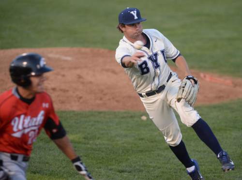 Steve Griffin  |  The Salt Lake Tribune

BYU pitcher Mason Marshall fires wide to first base during the BYU and Utah baseball game at BYU in Provo, Tuesday, April 21, 2015.