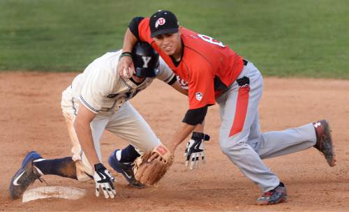 Steve Griffin  |  The Salt Lake Tribune

Utah shortstop Cody Scaggari tries to avoid BYU baserunner Eric Urry as he completes a double play during the BYU and Utah baseball game at BYU in Provo, Tuesday, April 21, 2015.