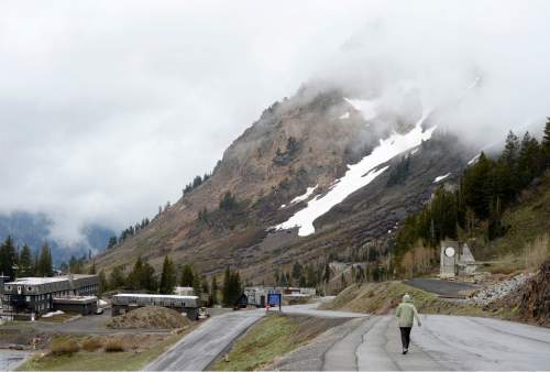 Al Hartmann |  The Salt Lake Tribune
A person takes a walk above the town of Alta as rain clouds hang over the mountain peaks in Little Cottonwood Canyon, Tuesday May 26, 2015. Stay tuned for another rainy work week in the mountains and valleys of northern Utah.