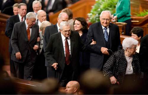 Jeremy Harmon  |  The Salt Lake Tribune

President Boyd K. Packer, center, is helped off the stand by Elder L. Tom Perry after the Saturday afternoon session of the 181st Semiannual General Conference of The Church of Jesus Christ of Latter-day Saints on Saturday, Oct. 1, 2011.