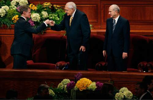Scott Sommerdorf   |  The Salt Lake Tribune
Elder David A. Bednar, left, fist bumps Elder L. Tom Perry with the empty chair of Elder Boyd K. Packer between them at the end of the afternoon session of the 183rd LDS General Conference, Sunday, April 7, 2013. Elder M. Russell Nelson is at the far right. Packer did not attend Sunday.