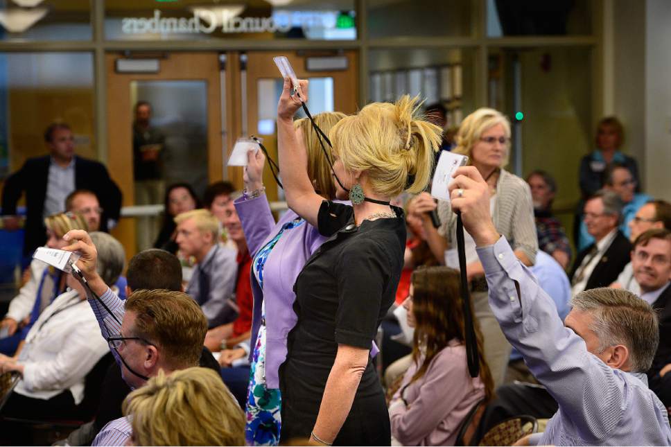 Scott Sommerdorf   |  The Salt Lake Tribune
Members vote during a sometimes contentious meeting to hash out the wording of changes to the bylaws of the Utah GOP constitution. The changes would let them conform with state law and have candidates on the 2016 ballot, Saturday, May 30, 2015.