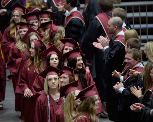 Al Hartmann |  The Salt Lake Tribune
The largest senior graduating class of Lone Peak High School marches in procession into the UCUU Events Center Thursday May 28, 2015, for commencement excercises as teachers applaud.