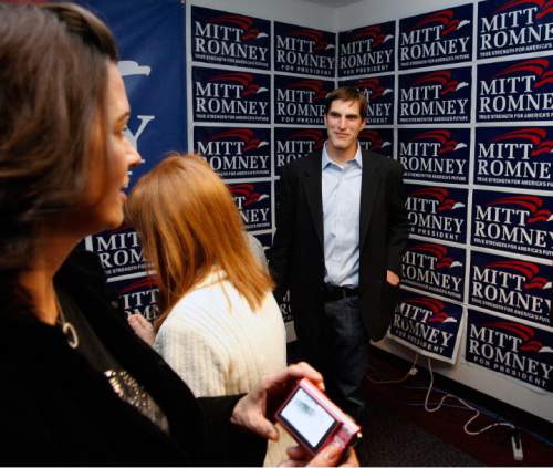 Steve Griffin  |  Tribune file photo
Josh Romney, son of presidential candidate Mitt Romney, talks with supporters at an election night gathering for his father in Sandy Feb. 5, 2008.