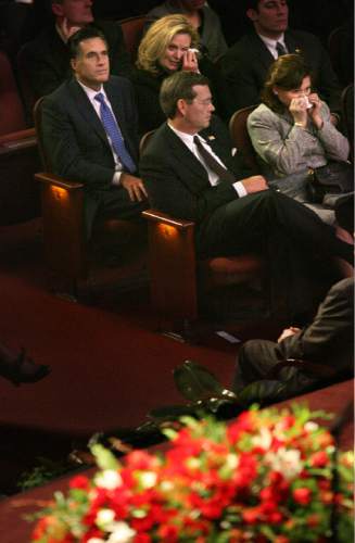 Scott Sommerdorf  |  Tribune file photo
Presidential candidate Mitt Romney (upper left) sits next to his wife, Ann, who along with Michael Leavitt's wife Jackie (lower right), are crying during President Gordon B. Hinckley's funeral held at the LDS Conference Center Saturday, Feb. 2, 2008. President Hinckley's casket is in the foreground.