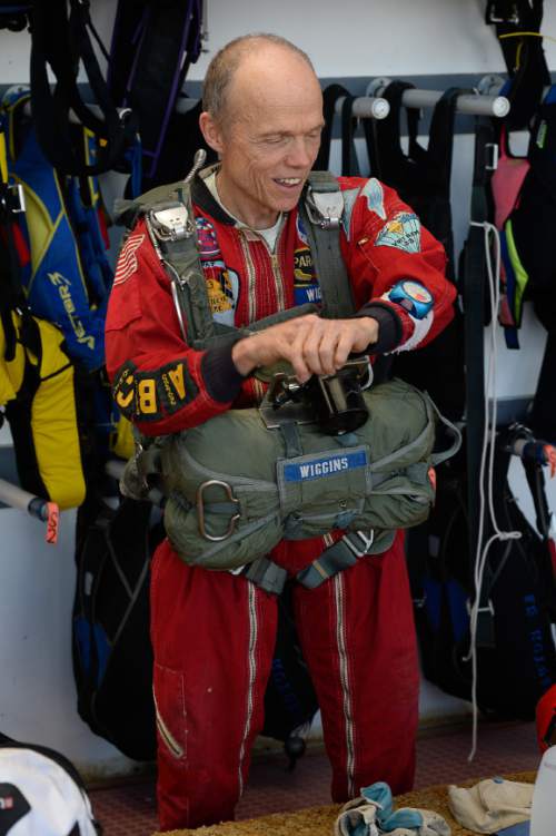 Francisco Kjolseth  |  The Salt Lake Tribune
NASA Ambassador Patrick Wiggins,  66, is no stranger to the sky with about 760 jumps under his belt. On Friday the education assistant at the University of Utah donned his original 1965 "antique parachute" and gear to mark the 50th anniversary of his first jump while joining friends at Skydive Utah, at the Tooele Valley Airport in Erda.