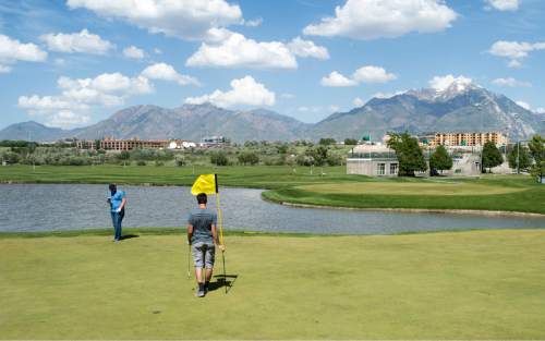 Rick Egan  |  The Salt Lake Tribune

David Nielson and Bronson Schroeder play golf at Mulligans, Monday, June 1, 2015.