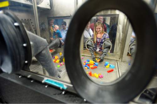 Steve Griffin  |  The Salt Lake Tribune


Kaisha Rose, 15, builds Legos in a glove box at the Dugway Proving Ground, in Dugway Utah during family day at the Chemical Test Division Thursday, December 5, 2013.