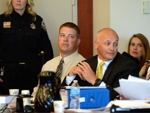 Scott Sommerdorf  |  The Salt Lake Tribune
Former West Valley City police officer Shaun Cowley, looks on as defense investigator Bruce Champagne, right confers with part of his defense team during day three of Cowley's preliminary hearing, Wednesday, October 8, 2014. Cowley is charged with second-degree felony manslaughter for Nov. 2, 2012, fatal shooting of 21-year-old Danielle Willard.