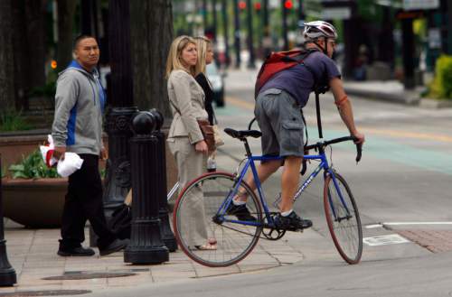 Francisco Kjolseth  |  Tribune file photo
Bicyclists make their way through down town traffic. Bikes and bike trails will be a big part of Utah's transportation future, according to urban planners.