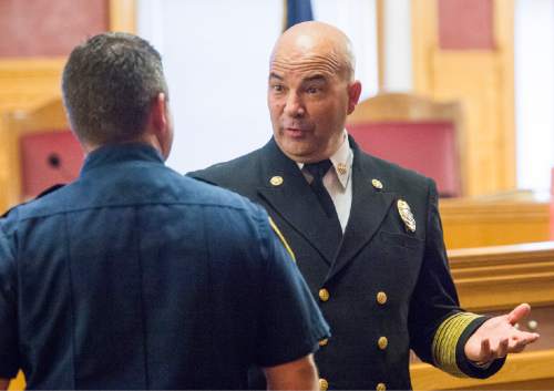 Rick Egan  |  The Salt Lake Tribune

Chief Brian Dale visits with family, friends and colleagues after being sworn in as the new Salt Lake City fire chief at City Hall, Thursday, June 4, 2015.