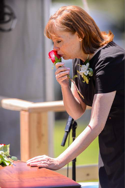 Trent Nelson  |  The Salt Lake Tribune
Linda Nelson kisses a rose before putting it onto her father, LDS apostle L. Tom Perry's casket, at his graveside service Friday June 5, 2015 at the Salt Lake City Cemetery.
