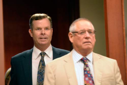 Al Hartmann  |  The Salt Lake Tribune 
Former attorney general John Swallow, left, and his attorney Stephen McCaughey enter Judge Royal Hansen's courtroom in Salt Lake City Wednesday July 30.  Swallow along with former attorney general Mark Shurtleff are charged with receiving or soliciting bribes, accepting gifts, tampering with evidence, obstructing justice and participating in a pattern of unlawful conduct.