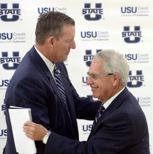 Al Hartmann |  The Salt Lake Tribune
Utah State University President Stan L. Albrecht, right, announced the hiring of John Hartwell as USU's new vice president and director of athletics at the Wayne Estes Center Wednesday June 3, 2015, in Logan. He will begin his duties in mid-July.