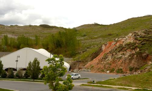 Leah Hogsten  | Tribune file photo
The view of the landslide in Eaglepointe Estates in North Salt Lake that destroyed one North Salt Lake home and damaged a tennis club in 2014, May 5, 2015. The city of North Salt Lake has a remediation plan ready to go and even a contractor to do the work, which would cost about $2 million. The city has agreed to chip in $200,000, but the developer, Sky Properties, hasn't agreed to pay anything yet.