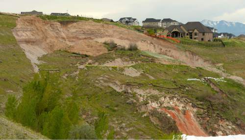 Leah Hogsten  |  Tribune file photo
The view of the landslide in Eaglepointe Estates in North Salt Lake that destroyed one North Salt Lake home and damaged a tennis club in 2014, May 5, 2015. The city of North Salt Lake has a remediation plan ready to go and even a contractor to do the work, which would cost about $2 million. The city has agreed to chip in $200,000, but the developer, Sky Properties, hasn't agreed to pay anything yet.