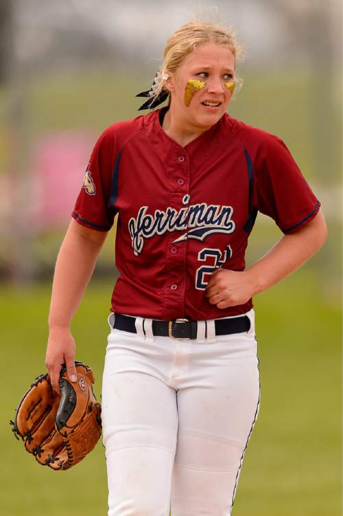 Trent Nelson  |  The Salt Lake Tribune
Herriman's Mikaela Thomson (23) takes a moment after being hit by a line drive as Herriman faces Lehi in the 5A high school softball championship game, in West Valley City, Friday May 22, 2015.