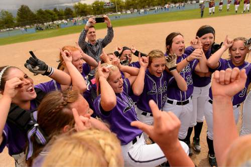 Trent Nelson  |  The Salt Lake Tribune
Lehi player celebrate after beating Herriman in the 5A high school softball championship game, in West Valley City, Friday May 22, 2015.