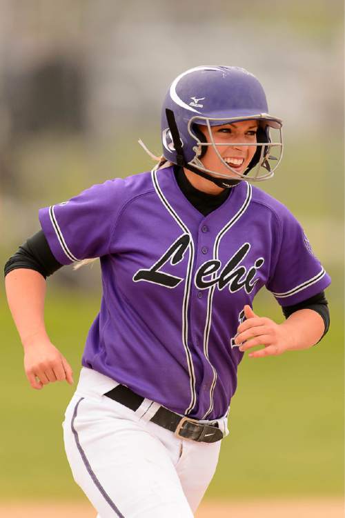 Trent Nelson  |  The Salt Lake Tribune
Lehi's Stephani Zimmerman rounds the bases after hitting a home run as Herriman faces Lehi in the 5A high school softball championship game, in West Valley City, Friday May 22, 2015.