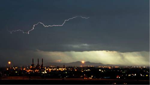 Lennie Mahler  |  The Salt Lake Tribune

A bolt of lightning strikes over the west side of Salt Lake City at sunset Saturday, June 6, 2015.