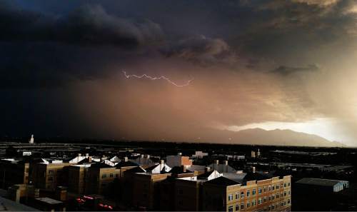 Lennie Mahler  |  The Salt Lake Tribune

A bolt of lightning strikes over the west side of Salt Lake City as the sun begins to set Saturday, June 6, 2015.