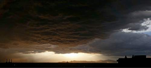 Lennie Mahler  |  The Salt Lake Tribune

The sun begins to set over the west side of Salt Lake City as a storm blows into the valley Saturday, June 6, 2015.