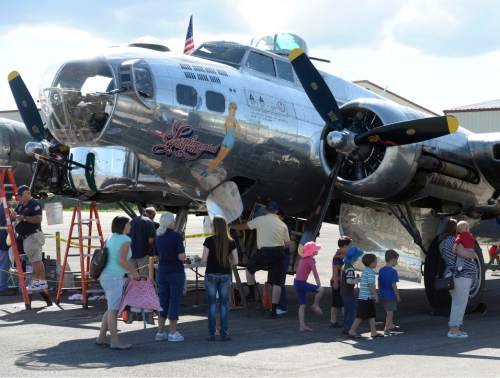 Al Hartmann |  The Salt Lake Tribune
People tour a restored B-17 Flying Fortress at the Heber City Airport Tuesday, June 8, 2015. The B-17, dubbed Sentimental Journey, is one of several restored vintage World War II planes on display. Sentimental Journey is giving tours and rides for a fee through Sunday.