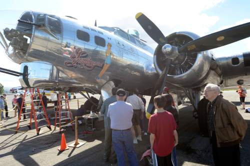 Al Hartmann |  The Salt Lake Tribune
People tour a restored B-17 Flying Fortress at the Heber City Airport Tuesday, June 8, 2015. The B-17, dubbed Sentimental Journey, is one of several restored vintage World War II planes on display. Sentimental Journey is giving tours and rides for a fee through Sunday.