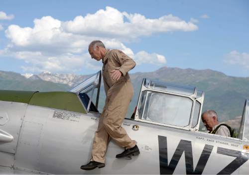 Al Hartmann |  The Salt Lake Tribune
Pilot Steve Guenard, left, climbs out of a restored T-6 Texan Navy-Air Force World War II training plane after a flight at the Heber City Airport Tuesday, June 8, 2015.  His passenger -- and pilot-- Steve Summers, right, of Salt Lake City "took the stick" for a few turns around the Heber Valley. Several restored vintage World War II planes are on display at "Sentimental Journey," including a B-17 "Flying Fortress dubbed Sentimental Journey, which is giving tours and rides for a fee through Sunday.